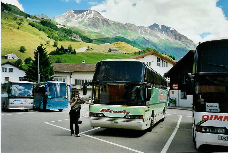 (048'724) - H�rzeler, Dietikon - Nr. 4/ZH 138'790 - Neoplan am 23. Juli 2001 beim Bahnhof Andermatt