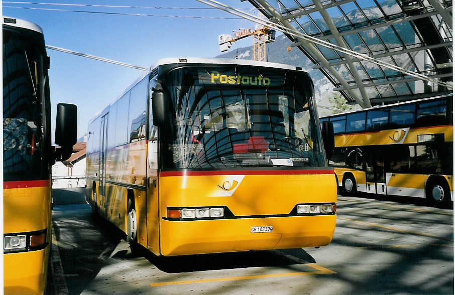 (062'236) - PostAuto Graub�nden - GR 102'394 - Neoplan (ex P 25'861) am 30. Juli 2003 in Chur, Postautostation