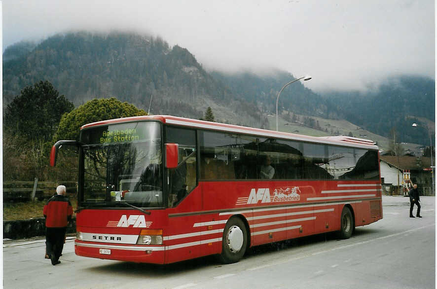 (066'014) - AFA Adelboden - Nr. 12/BE 26'702 - Setra am 14. M�rz 2004 beim Bahnhof Frutigen