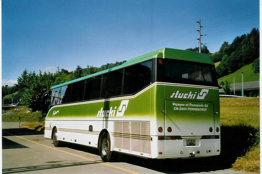 (068'814) - Stucki, Porrentruy - JU 4806 - Bova am 3. Juli 2004 beim Bahnhof M�lenen