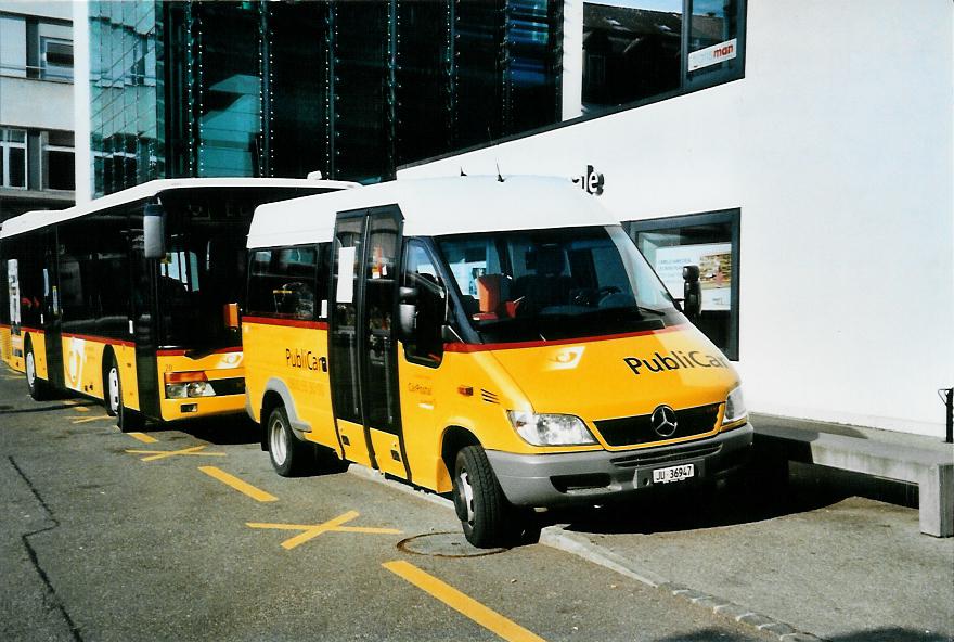 (104'509) - CarPostal Ouest - JU 36'947 - Mercedes/VDL-Kusters am 20. Februar 2008 beim Bahnhof Del�mont