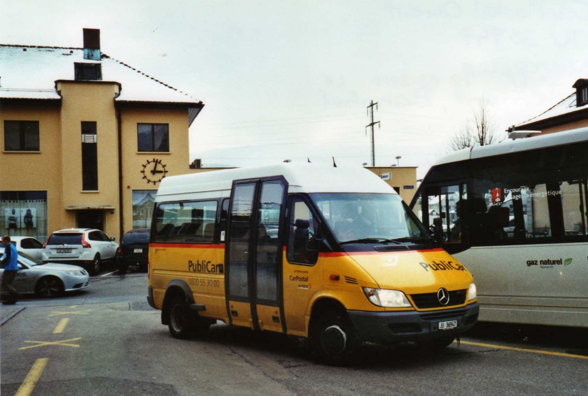 (124'430) - CarPostal Ouest - JU 36'947 - Mercedes/VDL-Kusters am 15. Februar 2010 beim Bahnhof Del�mont