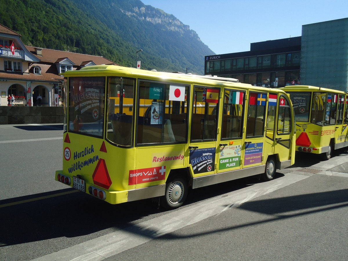 (134'672) - JungfrauPark, Matten - BE 681'188 - CMEC Personenanh�nger am 3. Juli 2011 beim Bahnhof Interlaken Ost