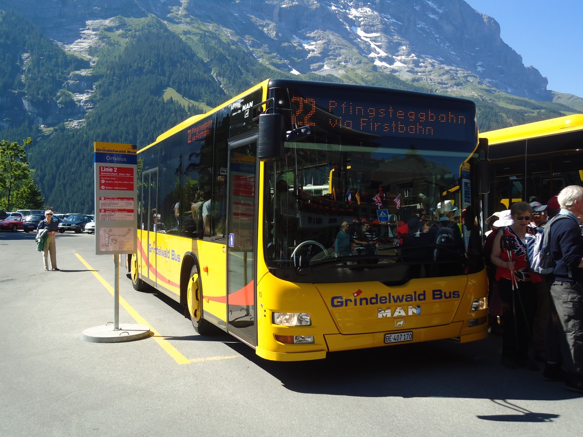 (134'678) - AVG Grindelwald - Nr. 13/BE 407'170 - MAN/G�ppel am 3. Juli 2011 beim Bahnhof Grindelwald