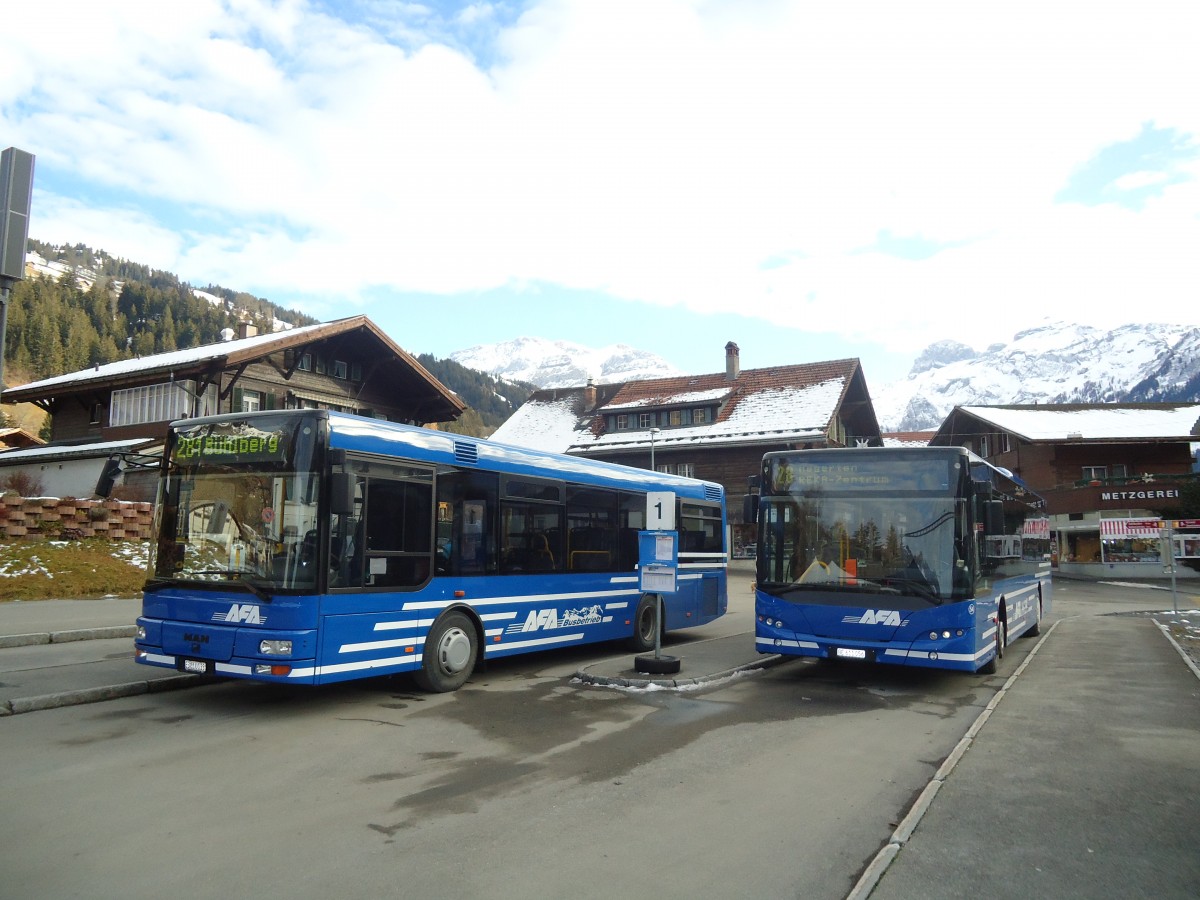 (137'190) - AFA Adelboden - Nr. 55/BE 611'055 - MAN/G�ppel + Nr. 54/BE 611'056 - Neoplan (ex VBZ Z�rich Nr. 243) am 11. Dezember 2011 beim Bahnhof Lenk