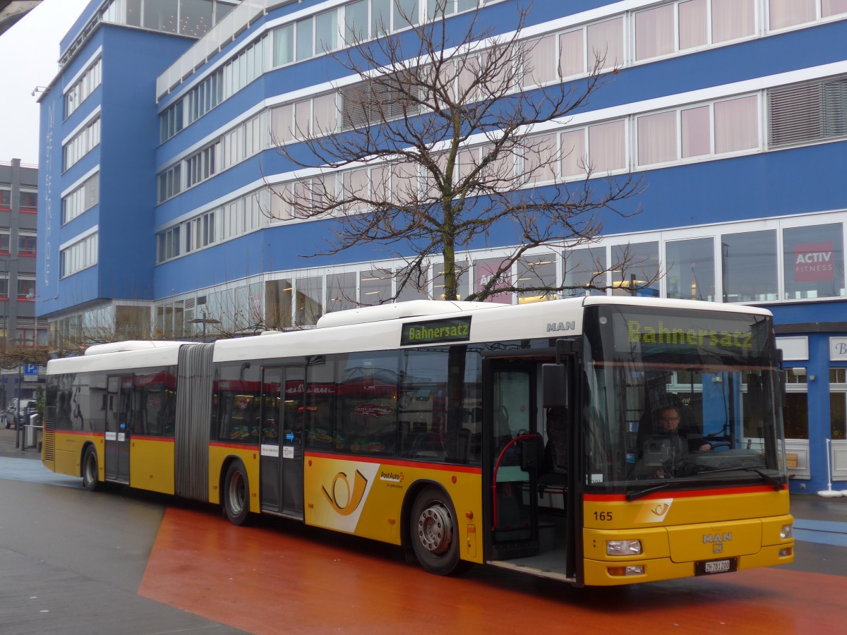 (168'169) - PostAuto Z�rich - Nr. 165/ZH 781'200 - MAN am 1. Januar 2016 beim Bahnhof Horgen