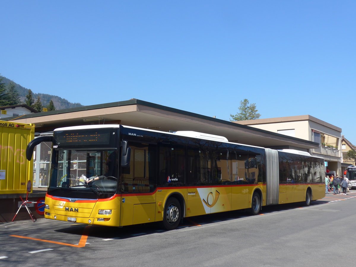 (203'327) - PostAuto Nordschweiz - AG 301'131 - MAN am 30. M�rz 2019 beim Bahnhof Hergiswil