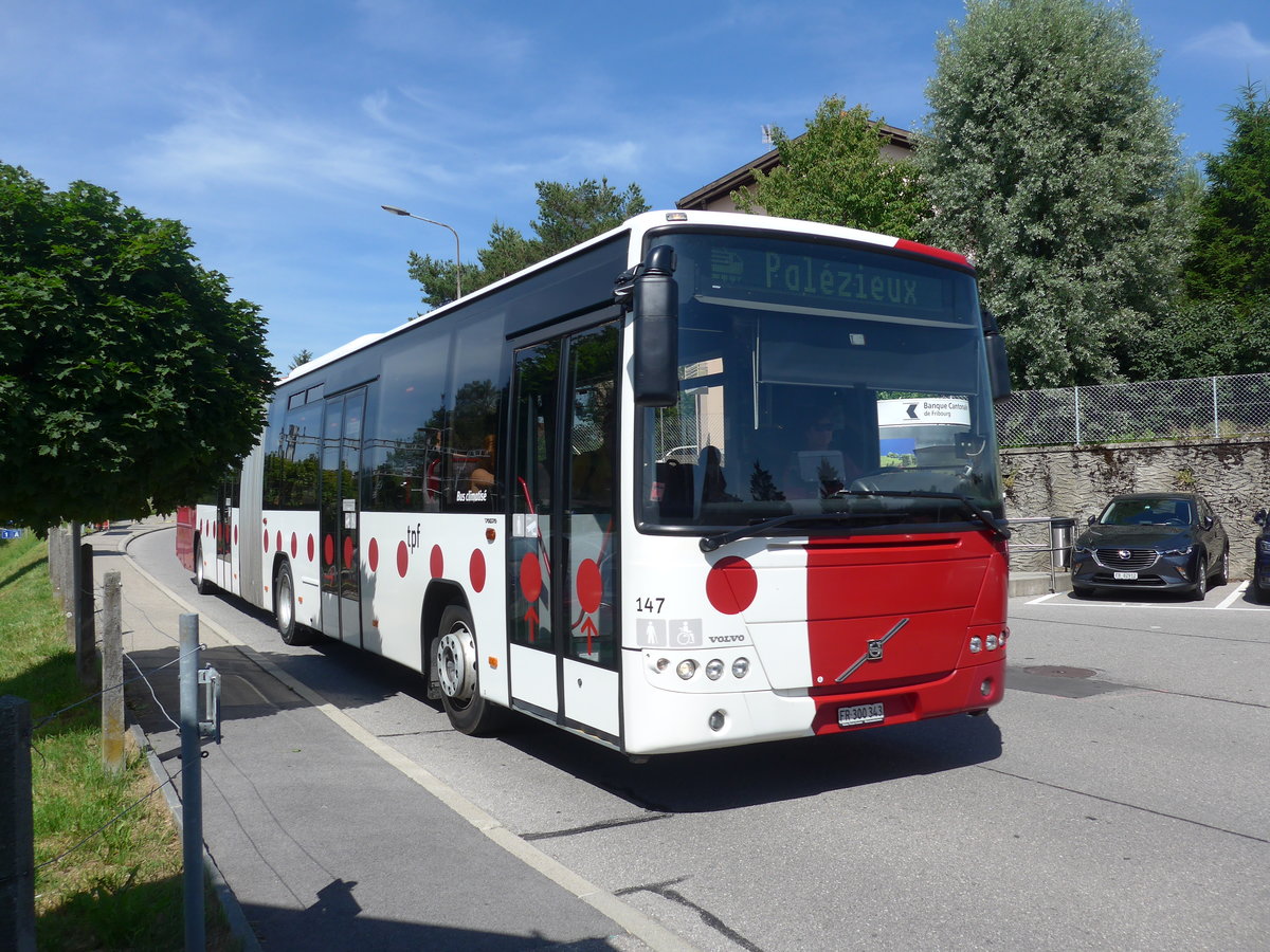 (206'844) - TPF Fribourg - Nr. 147/FR 300'343 - Volvo am 24. Juni 2019 beim Bahnhof Pal�zieux