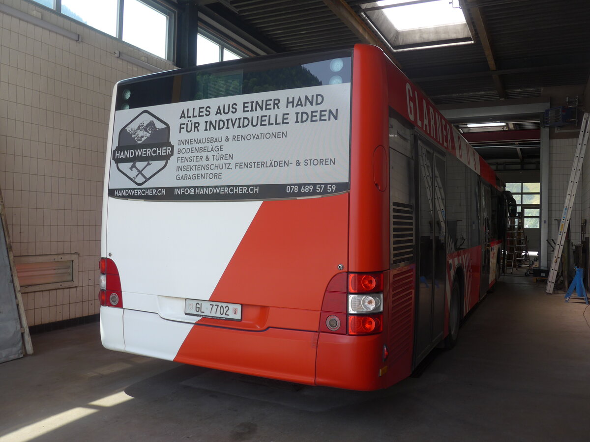 (226'473) - AS Engi - Nr. 2/GL 7702 - MAN (ex WilMobil, Wil Nr. 255; ex Vorf�hrfahrzeug) am 12. Juli 2021 in Engi, Garage
