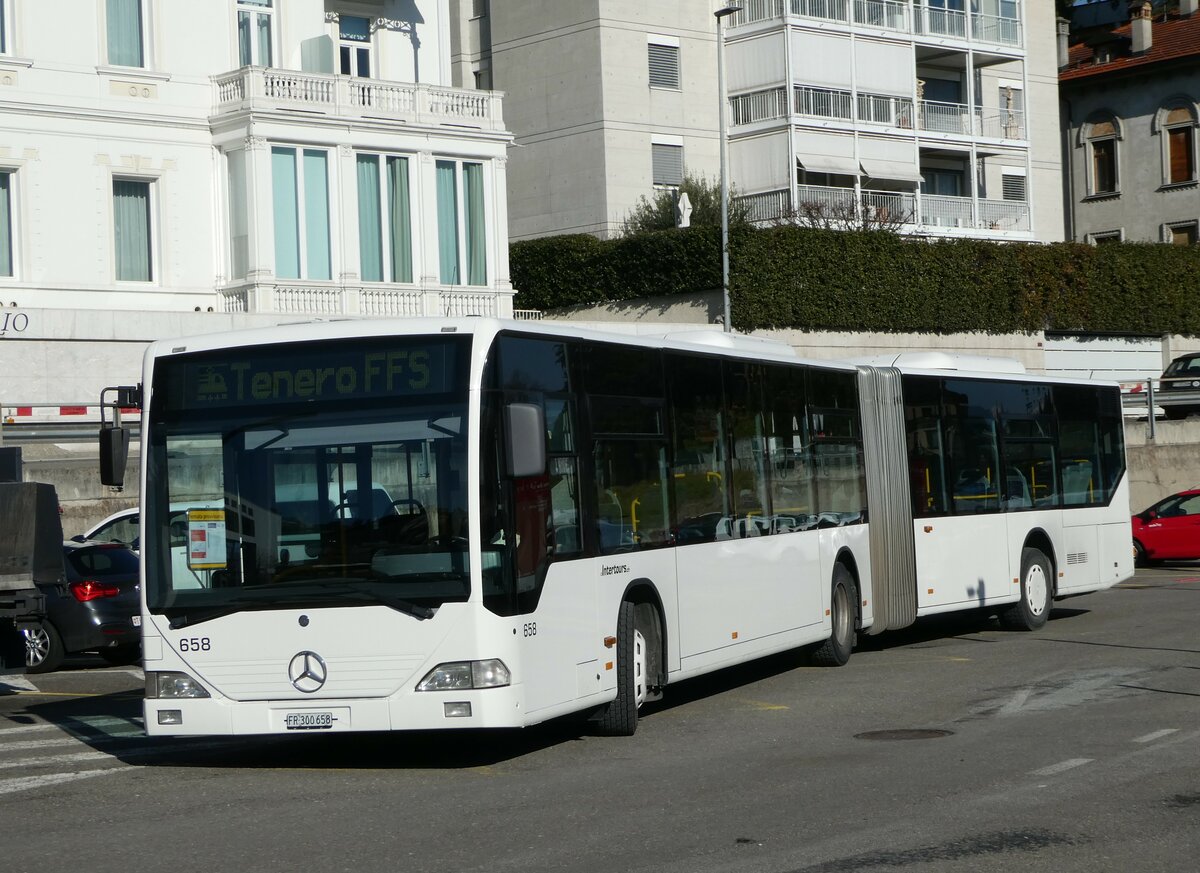 (245'940) - Intertours, Domdidier - Nr. 658/FR 300'658 - Mercedes (ex Nr. 206; ex VZO Gr�nigen Nr. 51) am 7. Februar 2023 beim Bahnhof Locarno