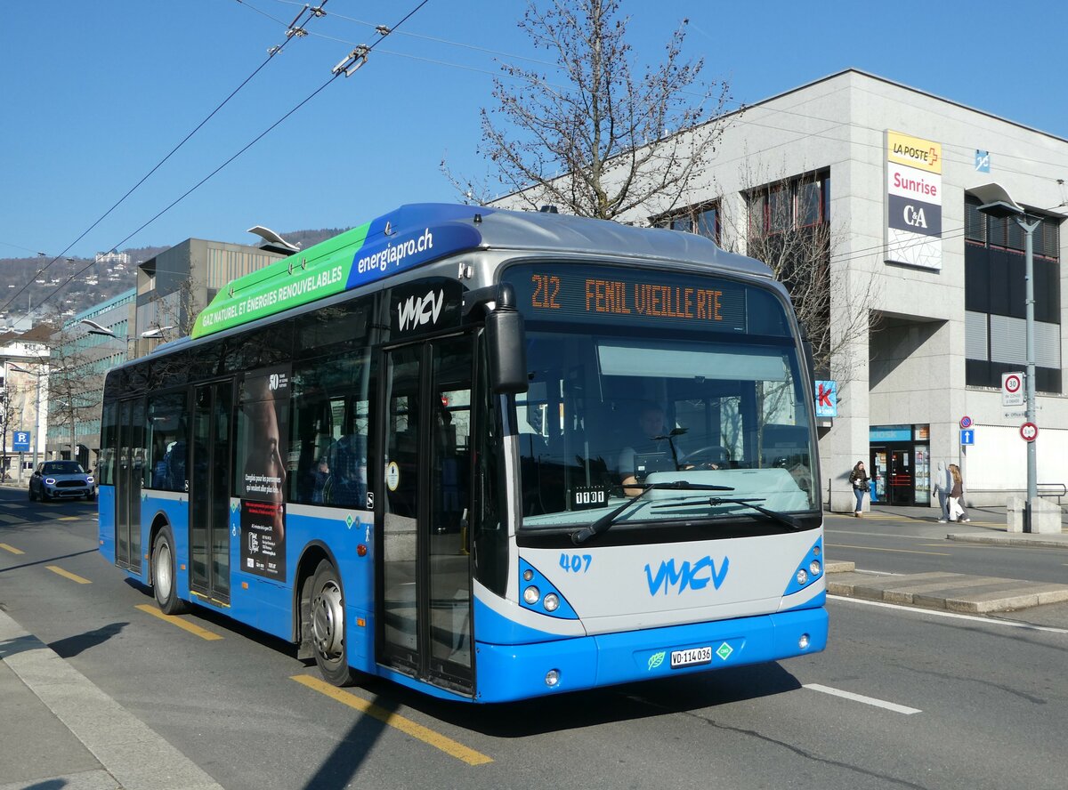 (245'969) - VMCV Clarens - Nr. 407/VD 114'036 - Van Hool (ex Nr. 107) am 9. Februar 2023 beim Bahnhof Vevey