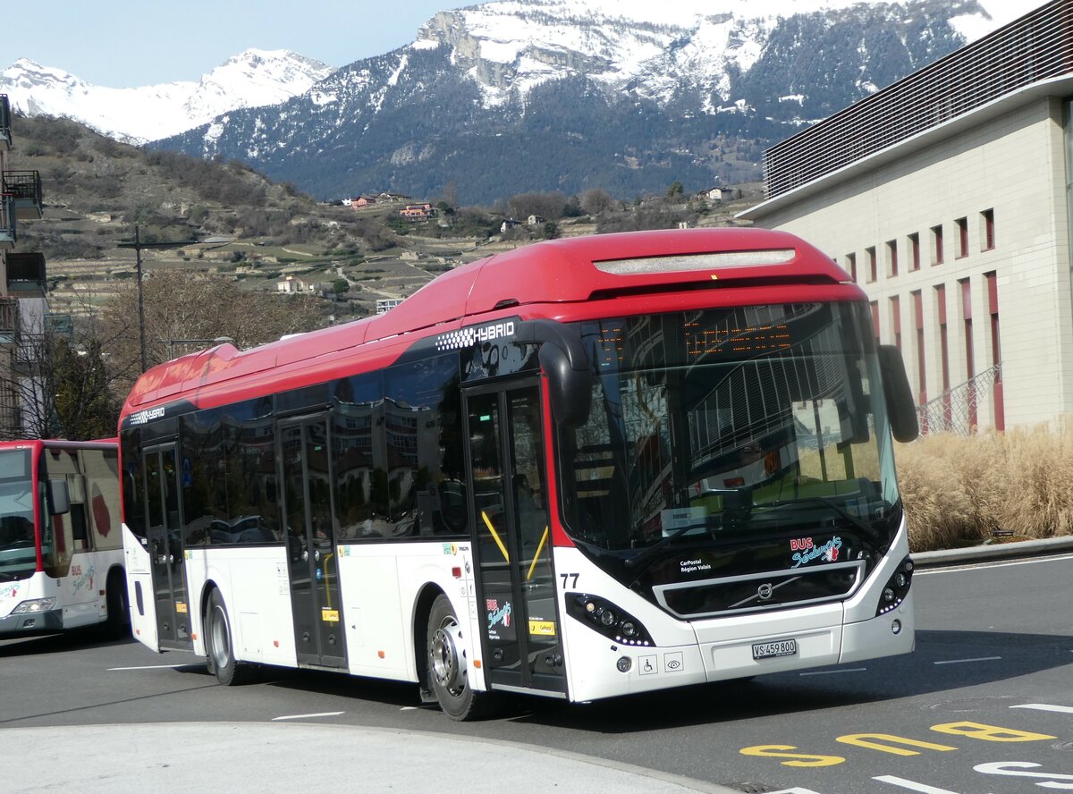 (247'256) - PostAuto Wallis - Nr. 77/VS 459'800/PID 10'640 - Volvo am 16. M�rz 2023 beim Bahnhof Sion