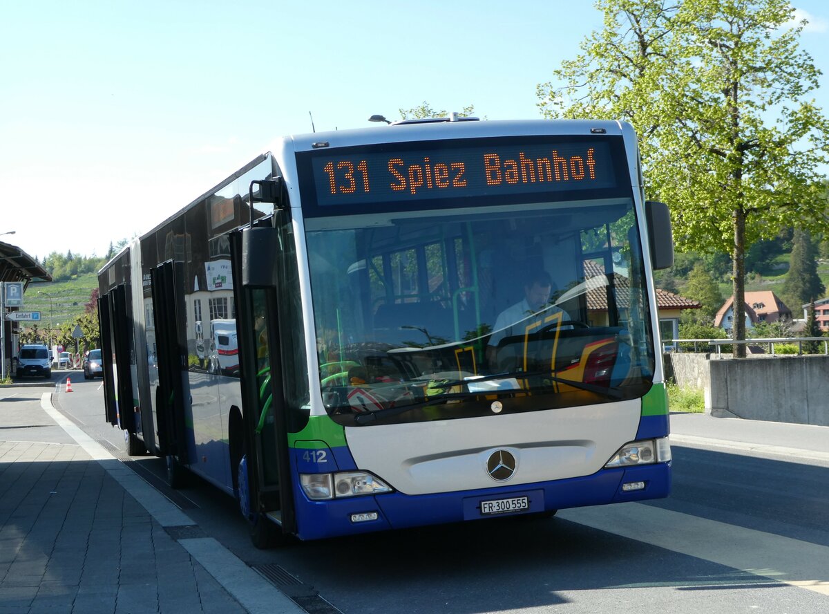 (249'495) - Intertours, Domdidier - Nr. 412/FR 300'555 - Mercedes (ex TPL Lugano Nr. 412) am 3. Mai 2023 beim Bahnhof Spiez