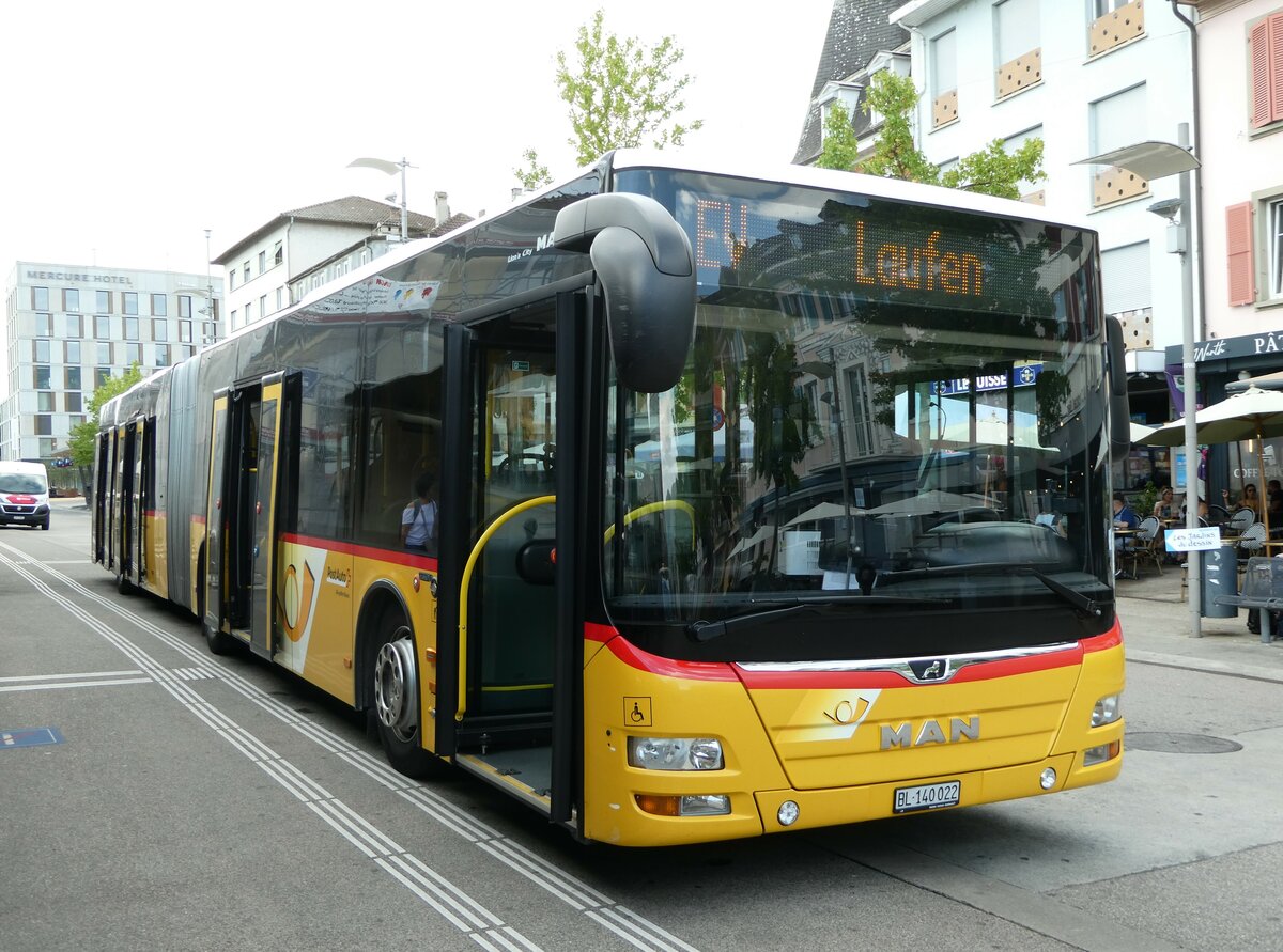 (253'707) - PostAuto Nordschweiz - BL 140'022/PID 10'830 - MAN am 12. August 2023 beim Bahnhof Del�mont