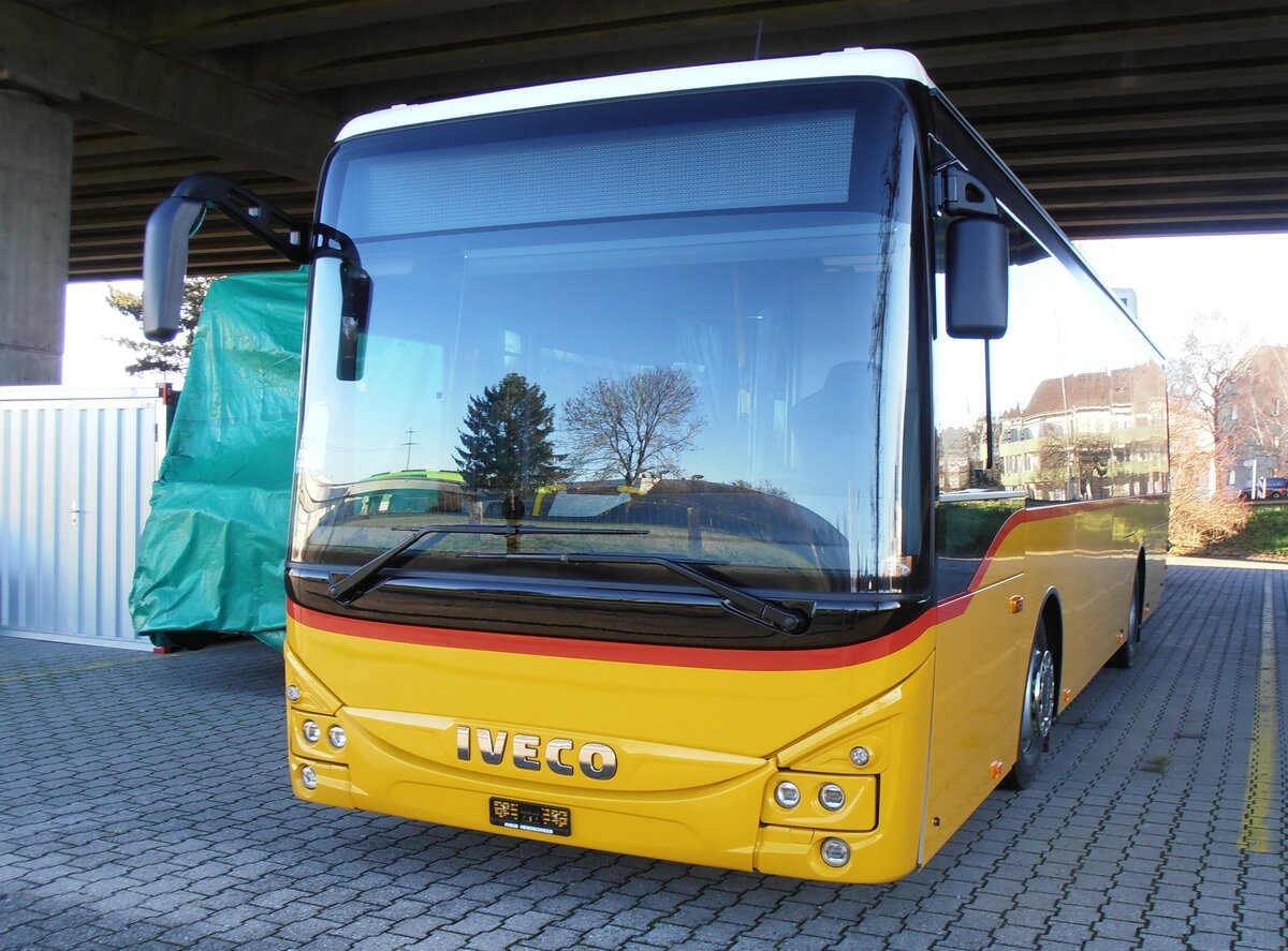 (257'919) - PostAuto Graub�nden - PID 12'012 - Iveco am 24. Dezember 2023 in Kerzers, Murtenstasse