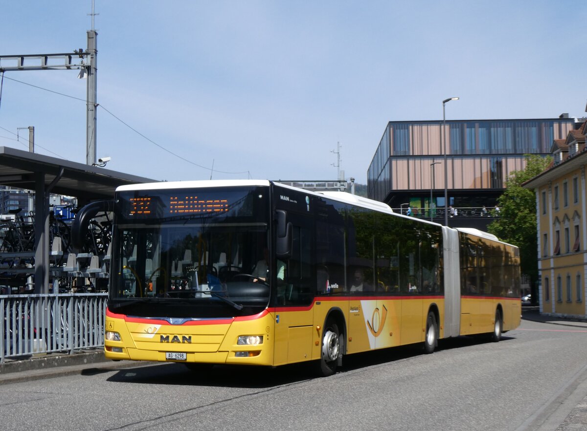 (261'199) - Twerenbold, Baden - Nr. 15/AG 6298/PID 10'351 - MAN am 12. April 2024 beim Bahnhof Baden