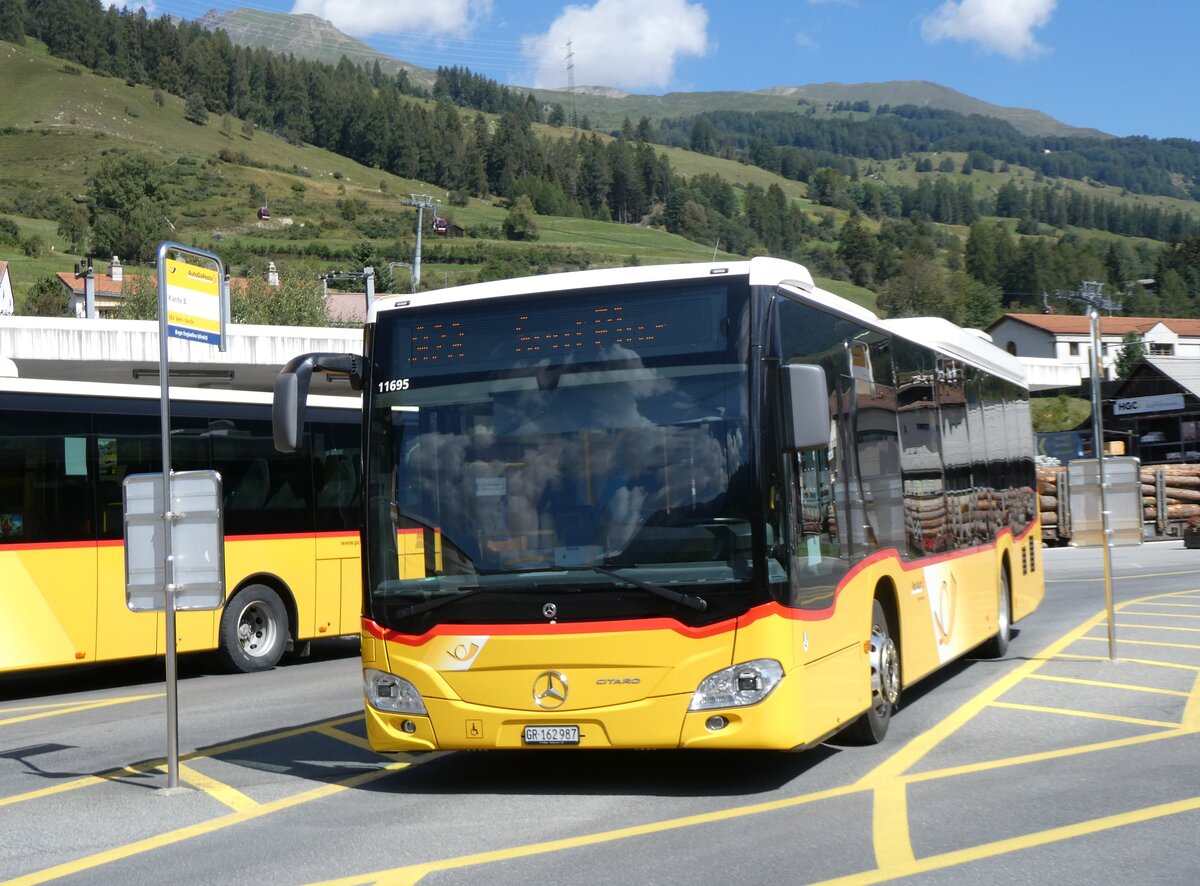 (266'230) - PostAuto Graub�nden - GR 162'987/PID 11'695 - Mercedes am 27. August 2024 beim Bahnhof Scuol-Tarasp