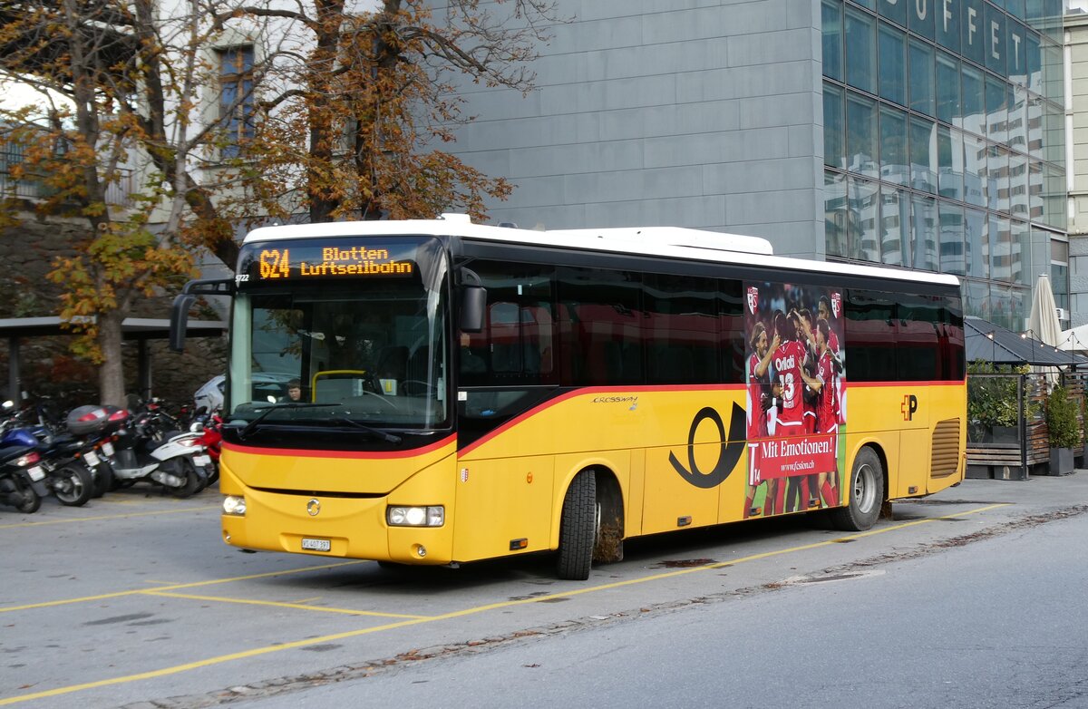 (281'785) - PostAuto Wallis - VS 407'397/PID 5722 - Irisbus am 24. Oktober 2025 beim Bahnhof Brig