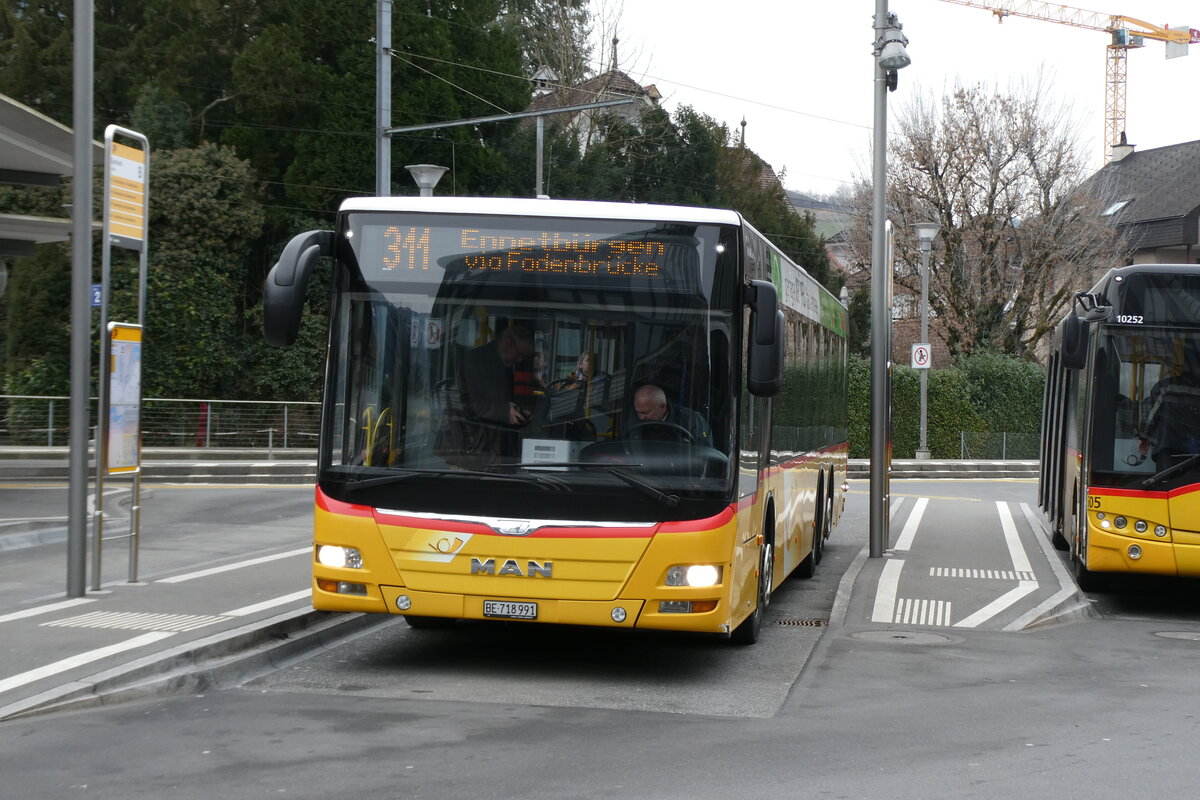 (284'600) - PostAuto Bern - BE 718'991PID 10'526 - MAN am 3. Februar 2026 beim Bahnhof Stans